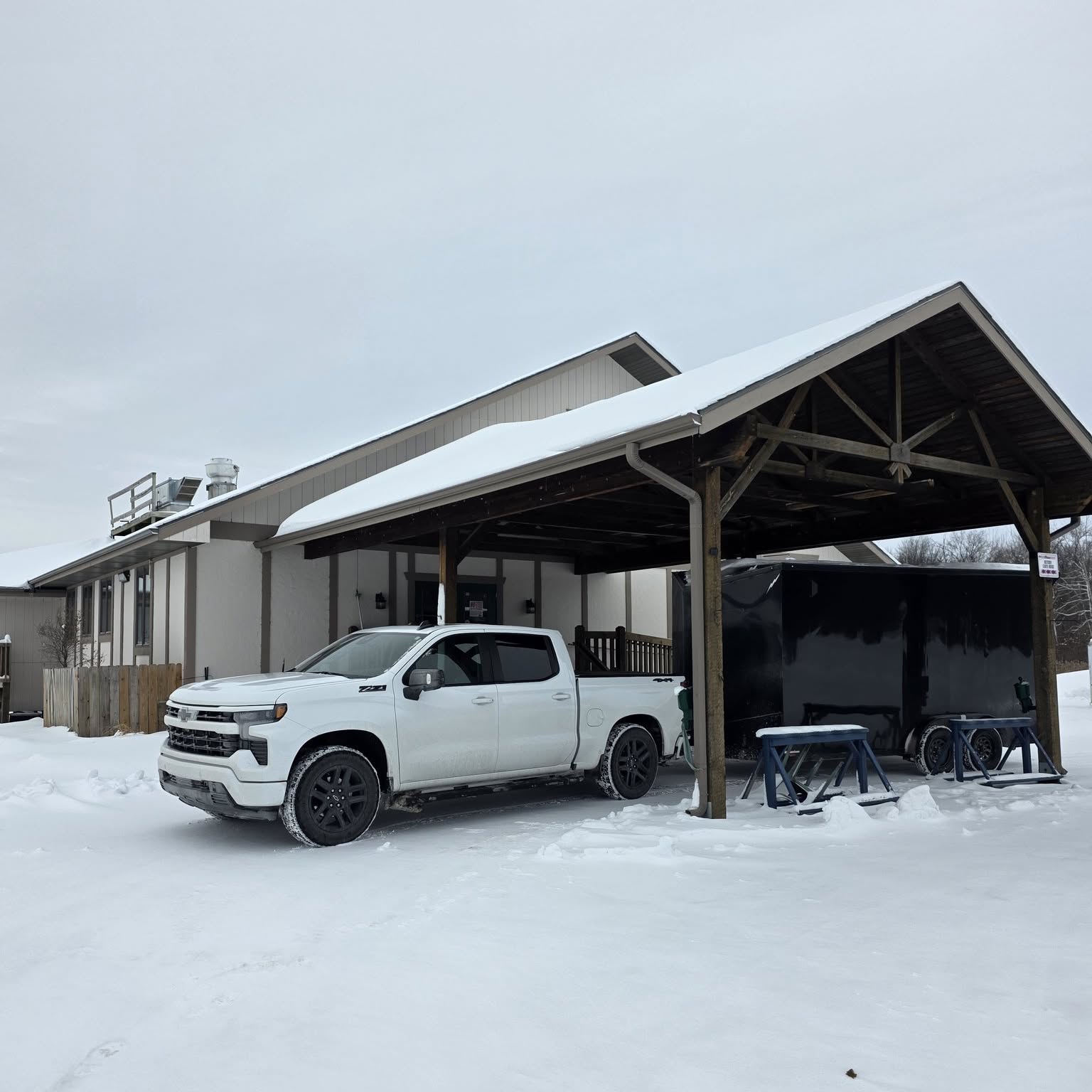 Custom Sims trailer on a Michigan job site during a winter install